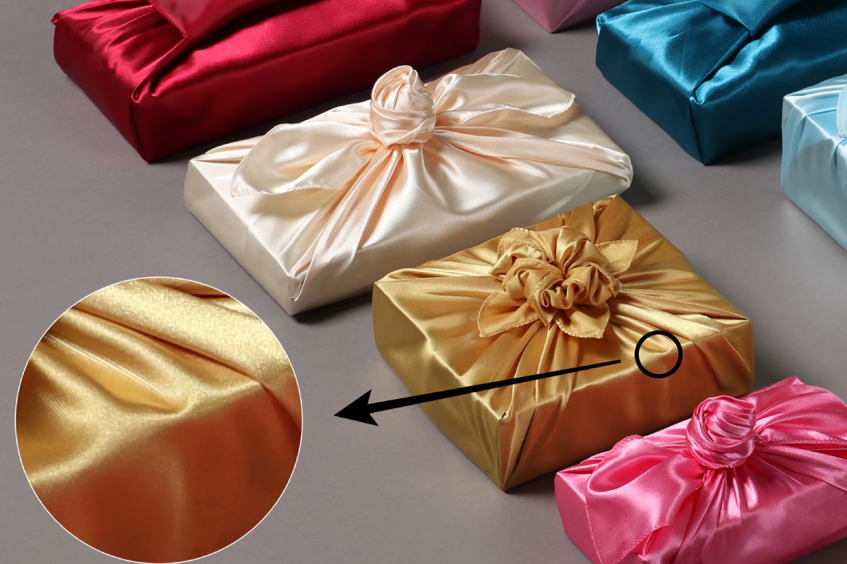 several boxes wrapped with Bojagi. close-up detail image showing glossy material.