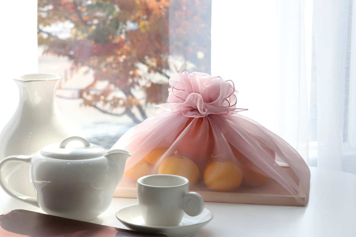 fruits rapped with pink color Bojagi.
